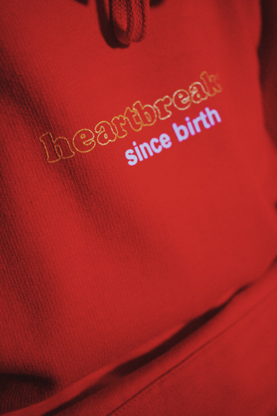 HEARTBREAKER SINCE BIRTH LIMITED EDITION HOODIE IN RED